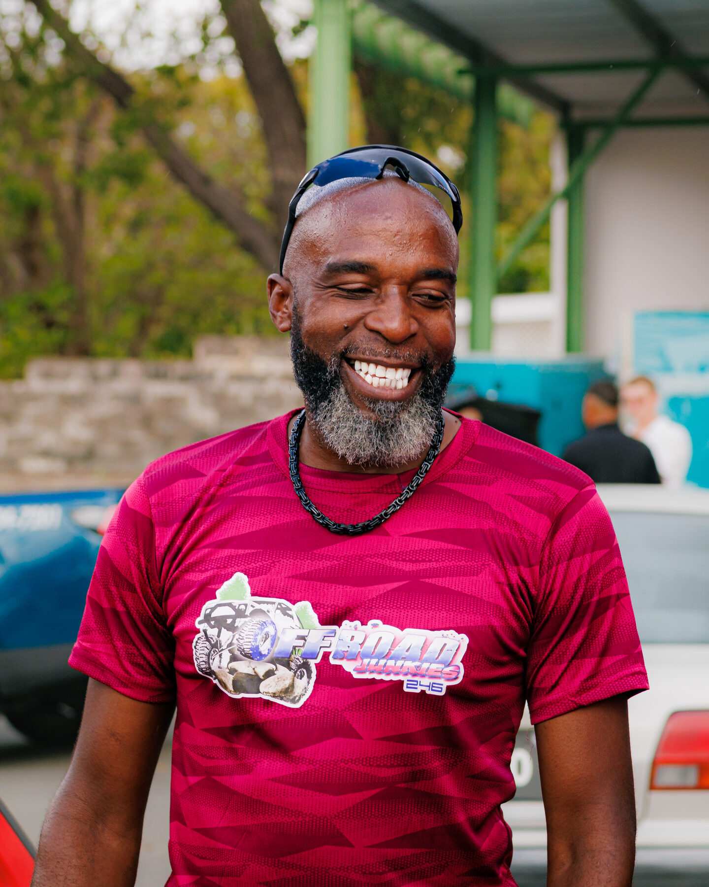 Smiling attendee photographed at Cars and Coffee Barbados