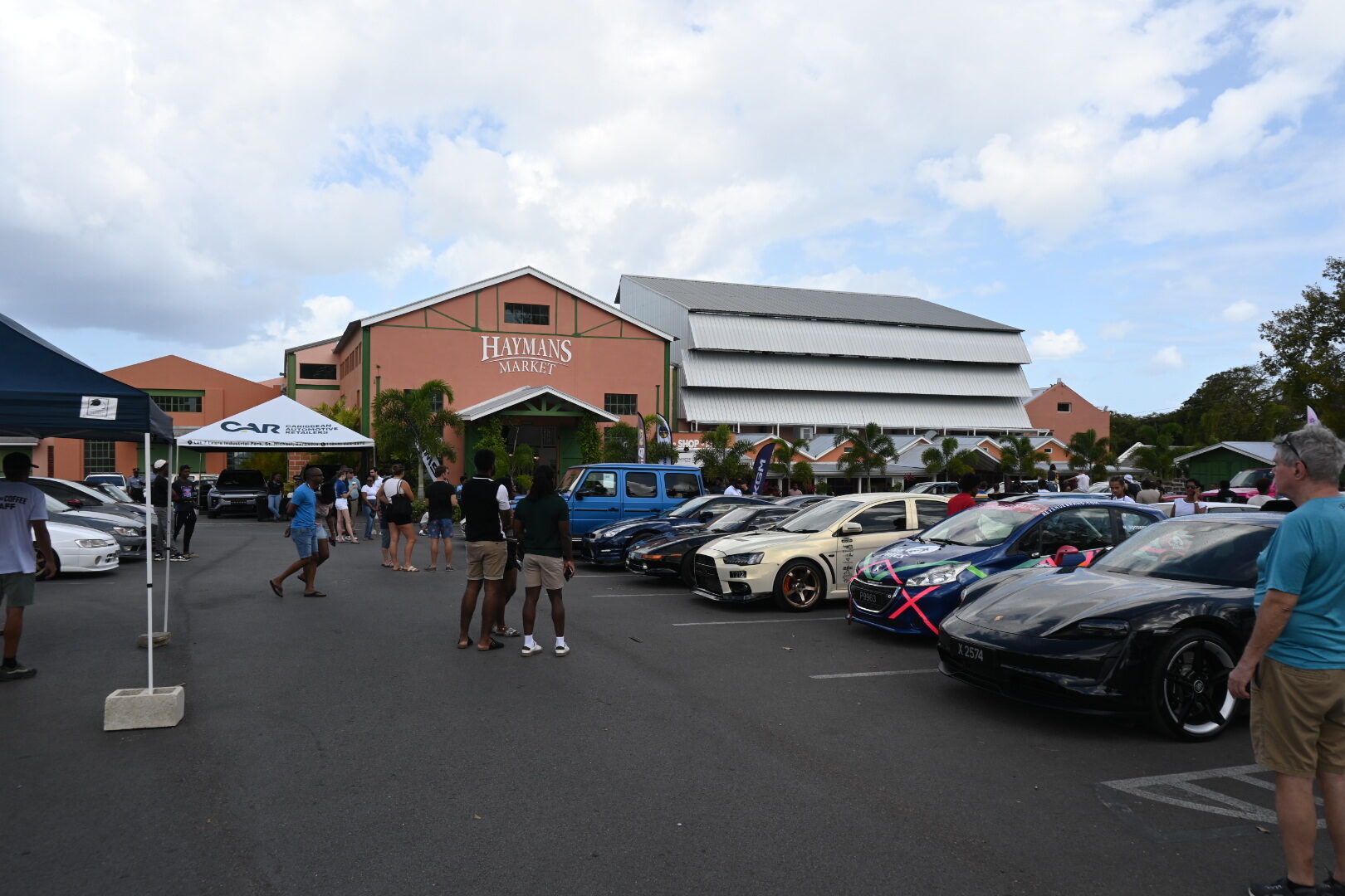 Wide view of the Cars and Coffee Barbados gathering at Haymans Market