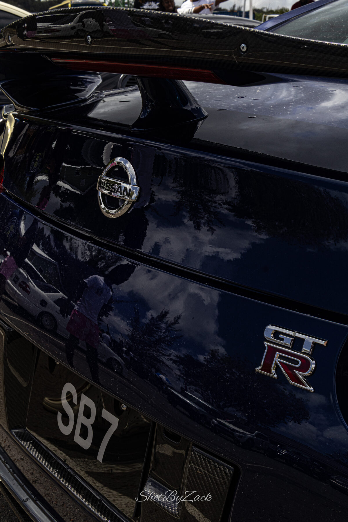 Nissan GT-R badge detail photographed at Cars and Coffee Barbados