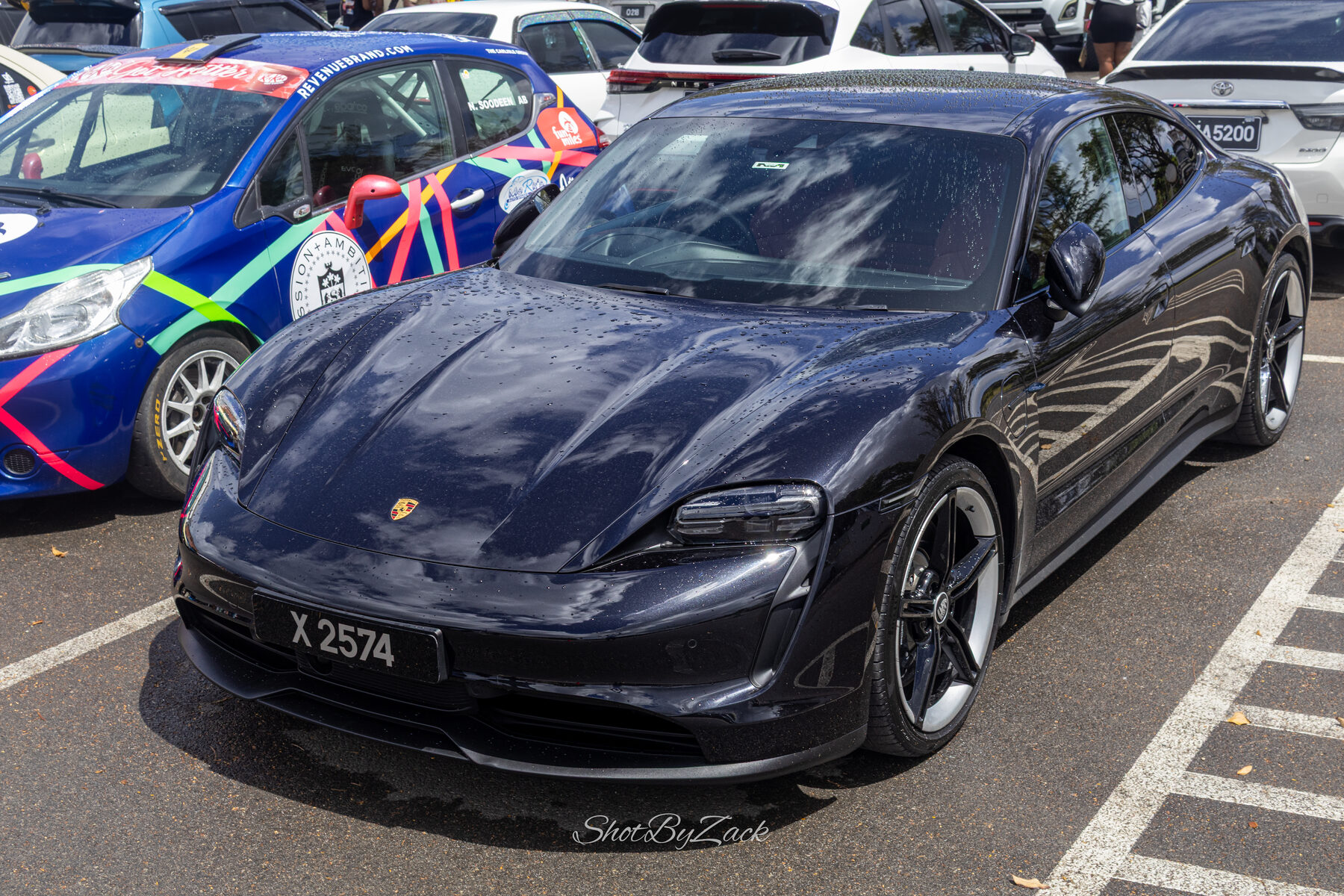 Black Porsche parked at Haymans Market during Cars and Coffee Barbados